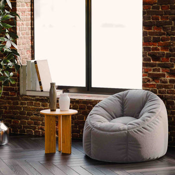 Solid oak end table styled as a small accent table in a cozy living room with neutral decor and soft lighting