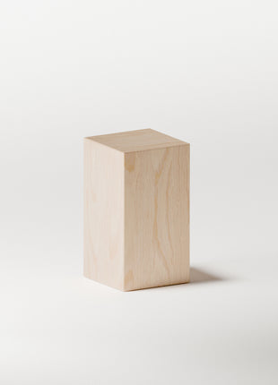 Maple solid wood end table with smooth edges, photographed in natural light to highlight warm wood texture
