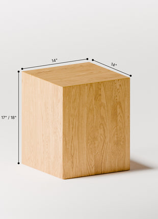 Wooden cube with dimensions labeled on a white background