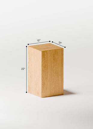 Wooden cube with dimensions labeled on a white background