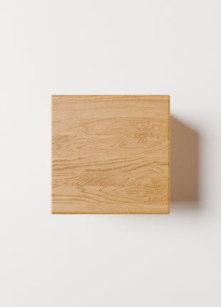 Solid wood end table's top view on a white background