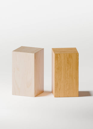 Two wooden block end table on a white background