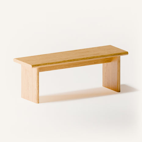 Modern solid wood nightstand styled in an entryway as a small side table, holding a bowl and decorative vase in a minimalist home