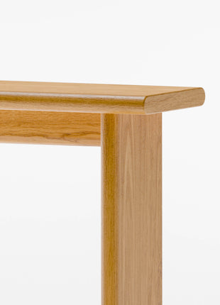 Close-up of a wooden console table on a white background