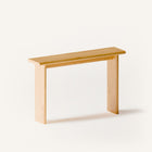 Modern solid wood console table in oak shown from a front view, emphasizing clean profile and seamless wall mounted design