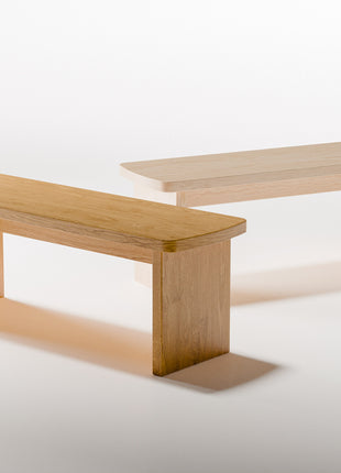 Maple solid wood nightstand with smooth edges and open shelf, styled with a table lamp and book in a bright minimalist bedroom