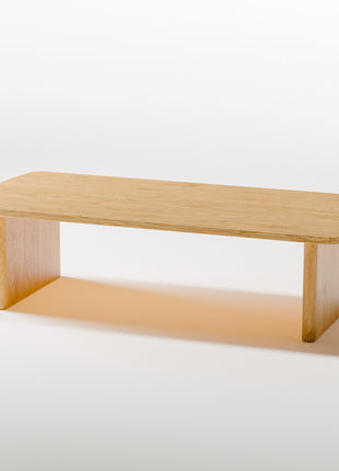 Modern solid wood coffee table close up detail of oak grain and smooth handcrafted edges, highlighting quality hardwood construction