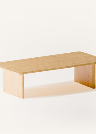 Modern solid wood coffee table close up detail of oak grain and smooth handcrafted edges, highlighting quality hardwood construction