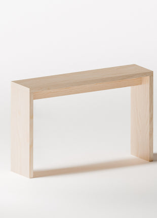 Maple solid wood console table with simple rectangular design, shown in a bright hallway with framed artwork above