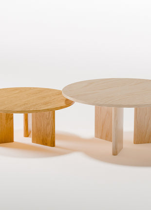 Modern solid wood coffee table in maple with clean profile and natural finish, photographed from above to show spacious tabletop surface
