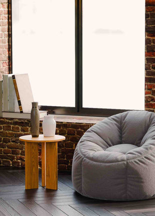 Solid oak end table styled as a small accent table in a cozy living room with neutral decor and soft lighting