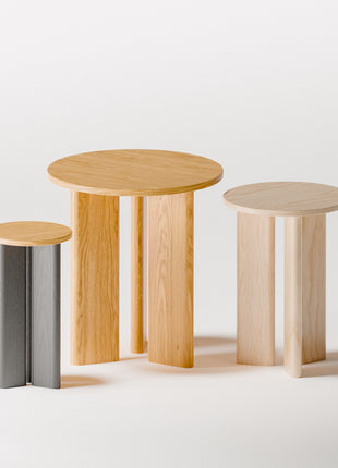 Modern solid wood side table close up detail highlighting visible wood grain and smooth hand finished surface